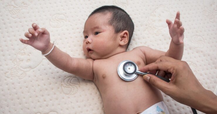 Doctor Exams Baby With Stethoscope